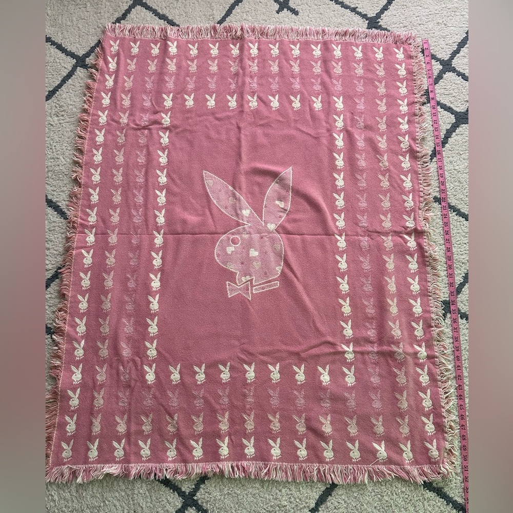 Playboy blanket light pinkish color. Approx. 52” x 41”